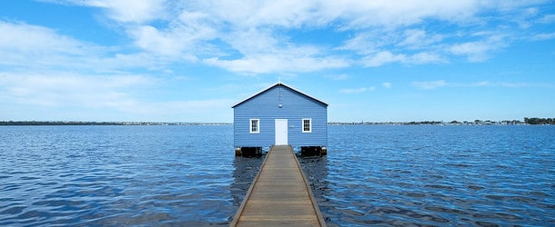 blue house on a lake