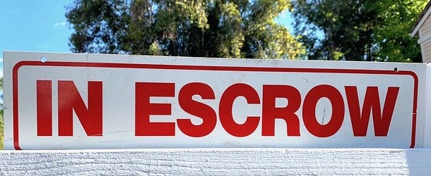 in escrow sign